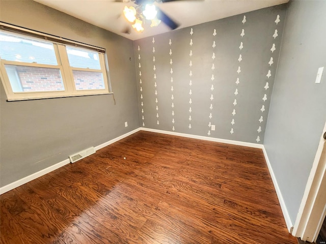 unfurnished room featuring ceiling fan and hardwood / wood-style floors