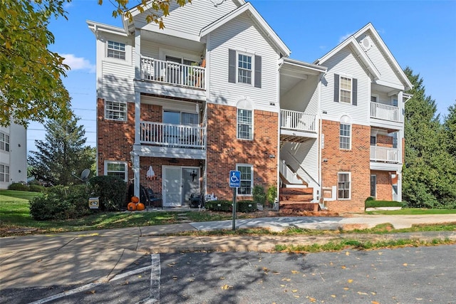 view of front of house featuring a balcony