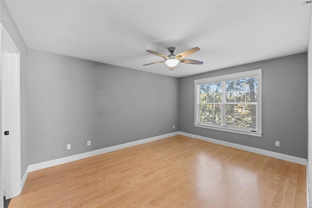 unfurnished room featuring ceiling fan and light hardwood / wood-style flooring