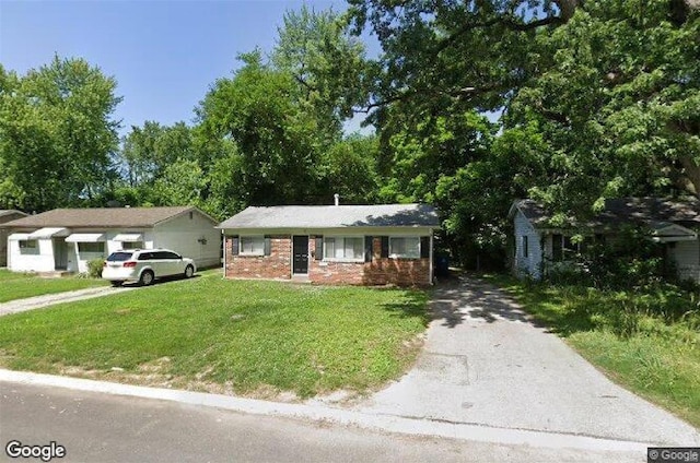 ranch-style home with a front lawn