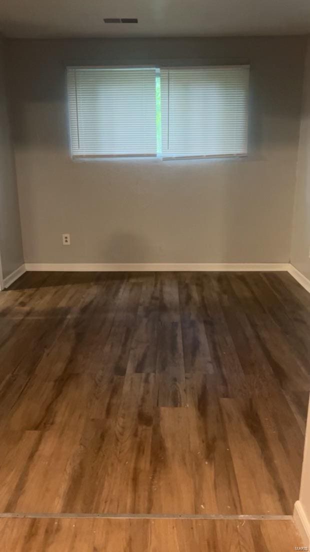 spare room featuring hardwood / wood-style flooring