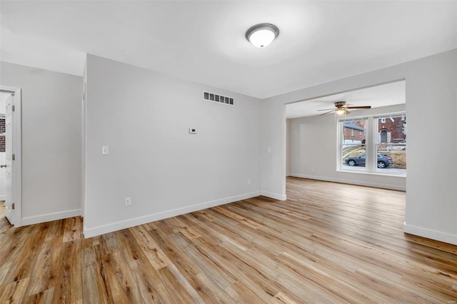 unfurnished room with ceiling fan and light hardwood / wood-style floors