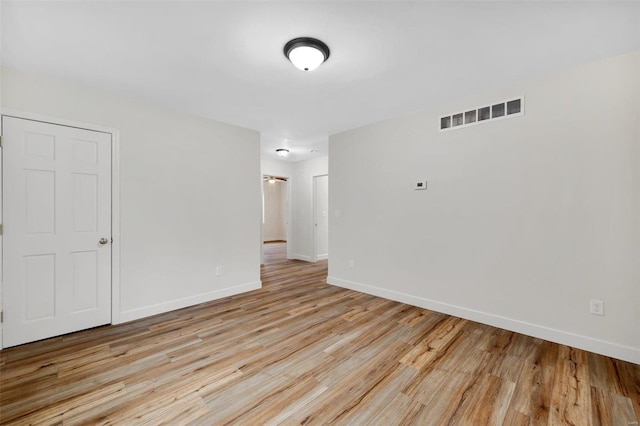 unfurnished room featuring light hardwood / wood-style flooring