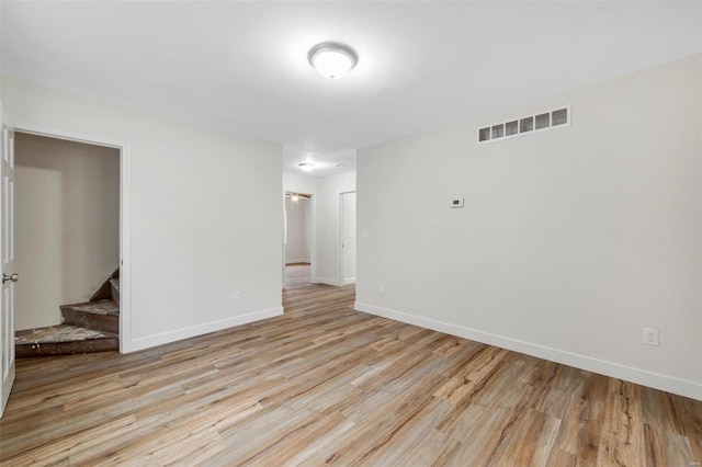 unfurnished room featuring light hardwood / wood-style floors