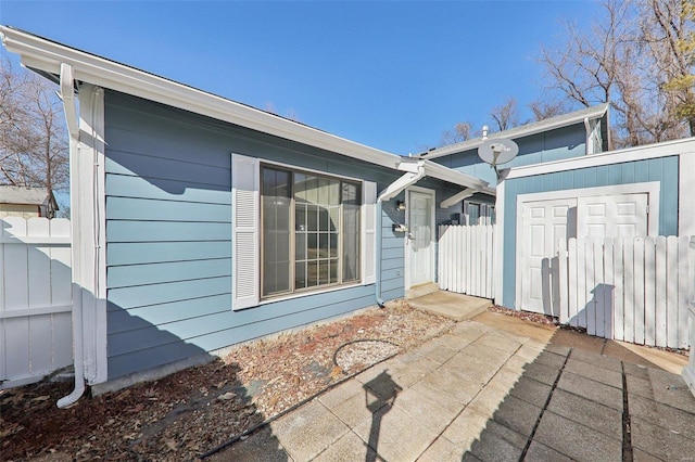 exterior space featuring a patio area and fence