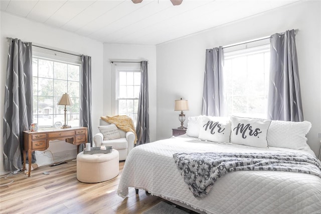 bedroom featuring wooden ceiling, ceiling fan, and light hardwood / wood-style flooring