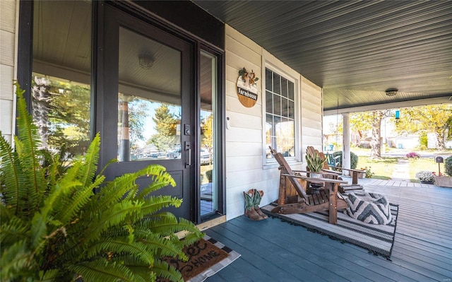 wooden terrace with a porch