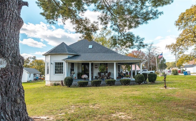 back of house with a yard and covered porch