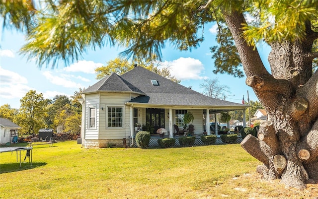 exterior space with a trampoline and a lawn