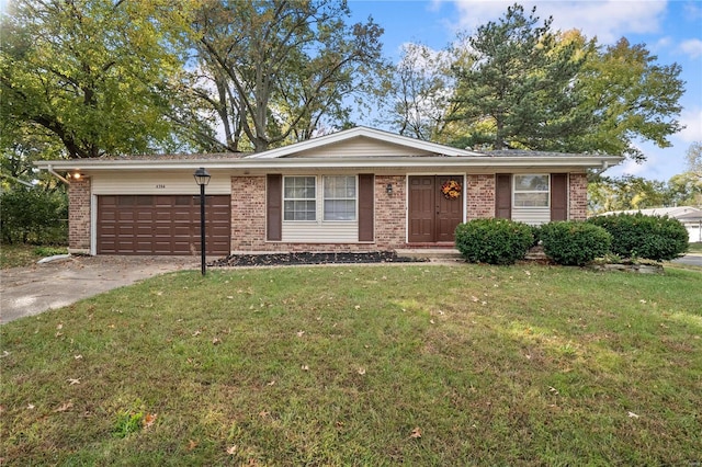 single story home featuring a front yard and a garage