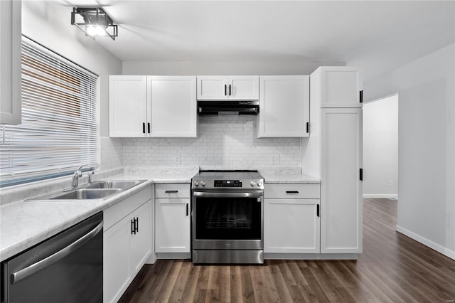 kitchen featuring sink, appliances with stainless steel finishes, white cabinets, and dark hardwood / wood-style flooring