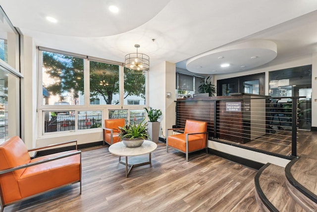 interior space with an inviting chandelier and hardwood / wood-style floors