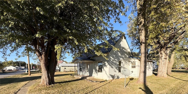 view of home's exterior with a lawn