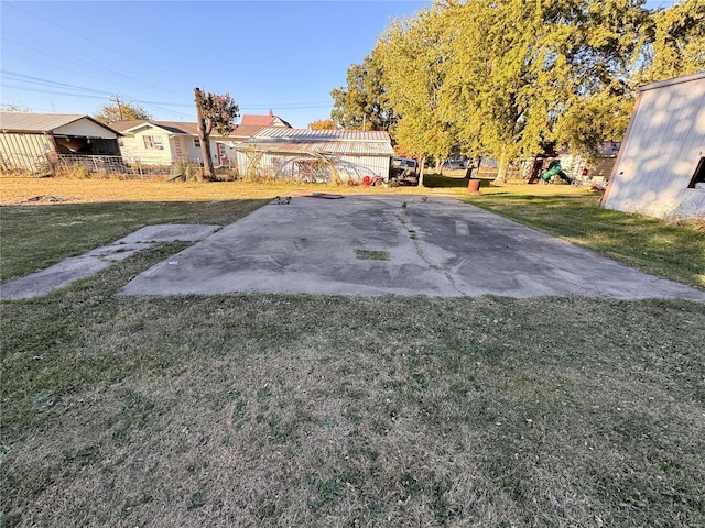 view of yard with fence and a playground