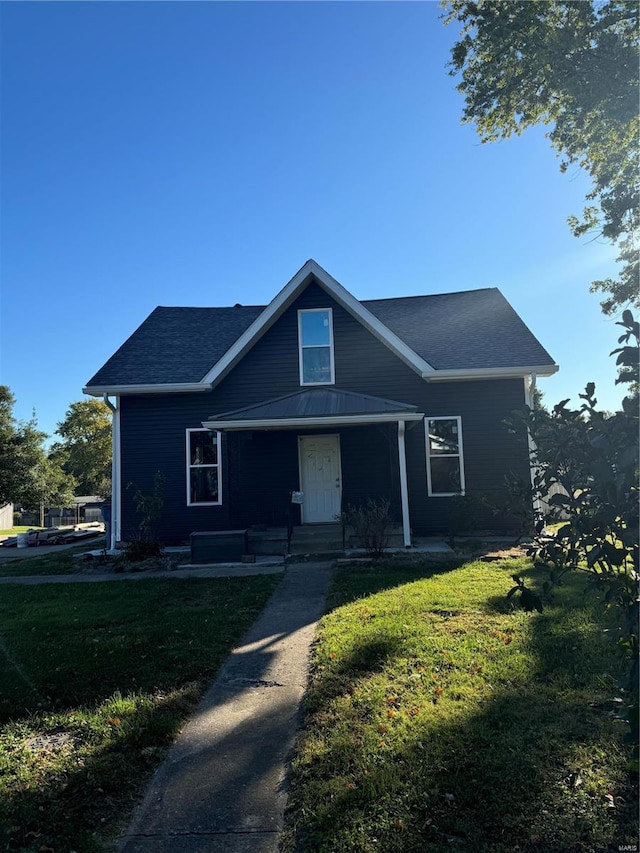 view of front of house featuring a porch and a front lawn