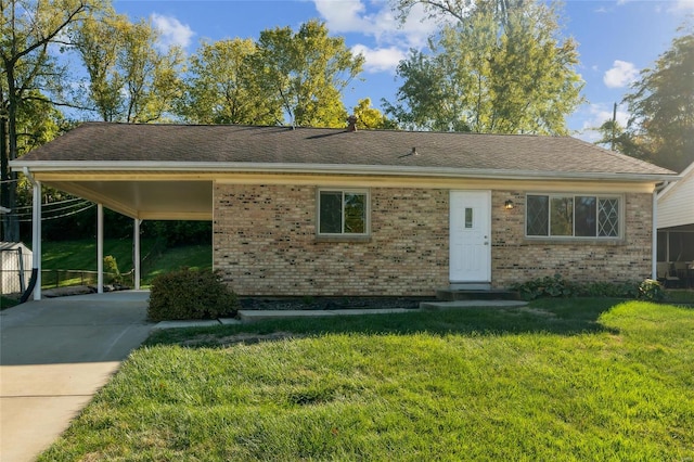 view of front facade with a front yard and a carport