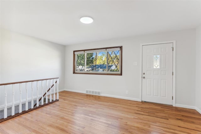 foyer with light hardwood / wood-style floors