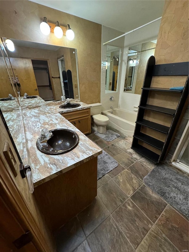 full bathroom with toilet, vanity, and independent shower and bath