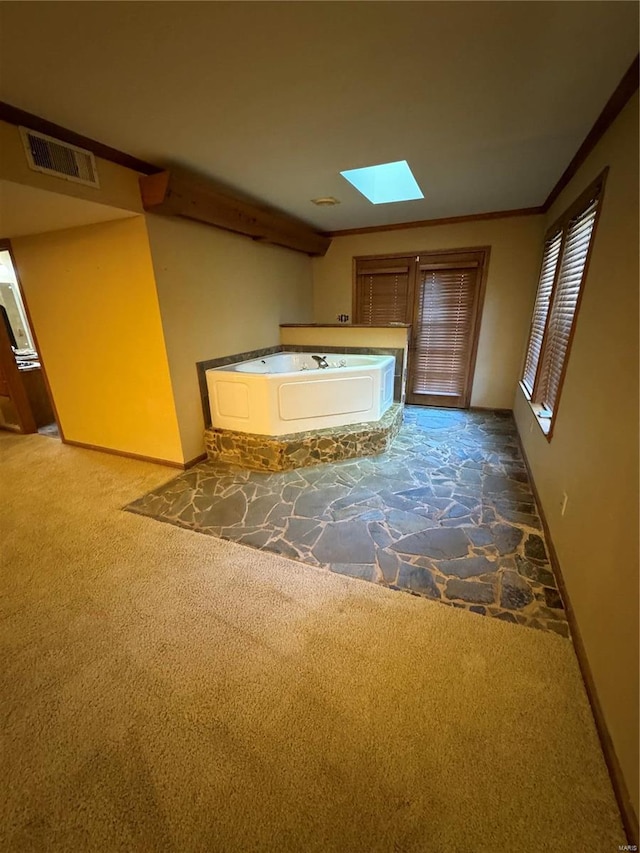 bathroom with a skylight