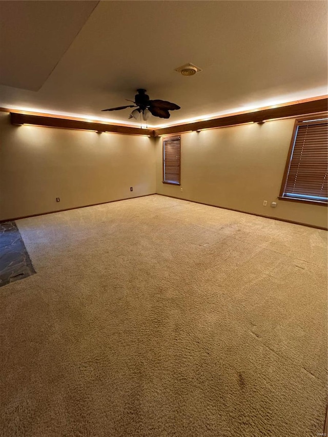 interior space with ceiling fan