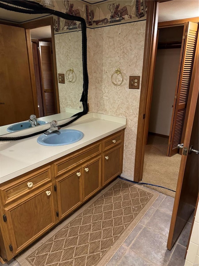 bathroom with vanity and tile patterned floors