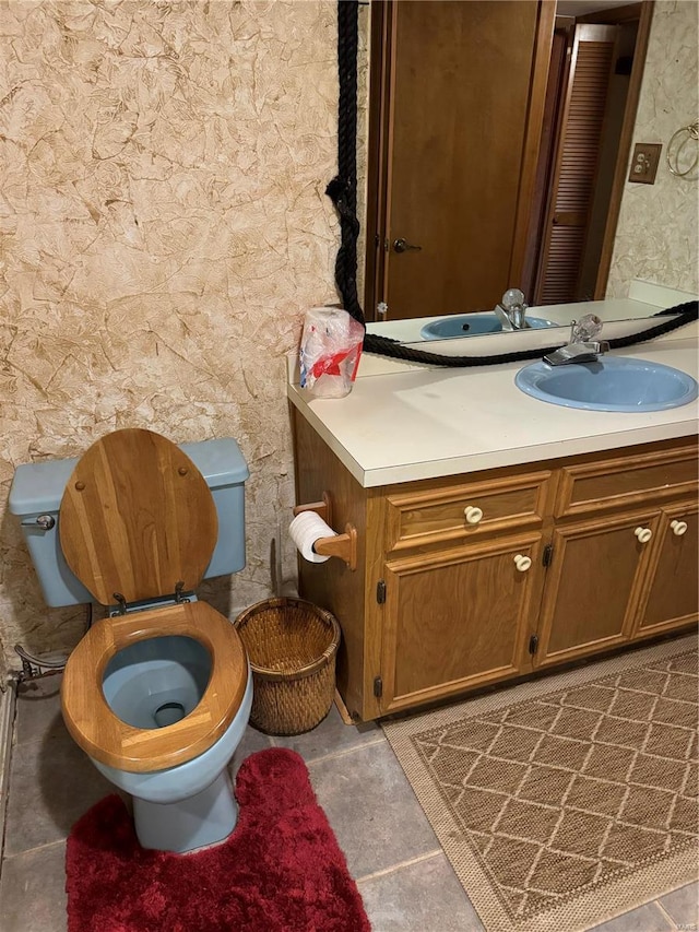 bathroom with toilet and vanity