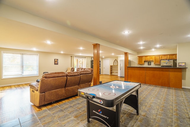 recreation room featuring wood-type flooring