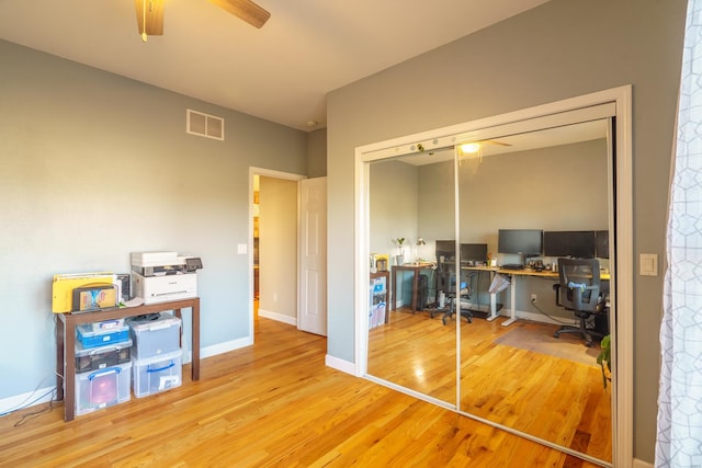 office featuring hardwood / wood-style floors and ceiling fan