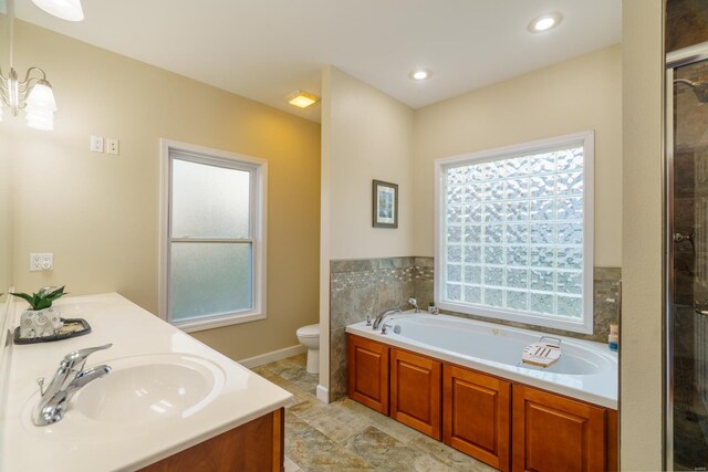 full bathroom with vanity, a notable chandelier, plus walk in shower, and toilet