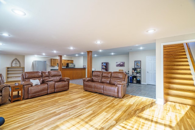 living room with light hardwood / wood-style floors