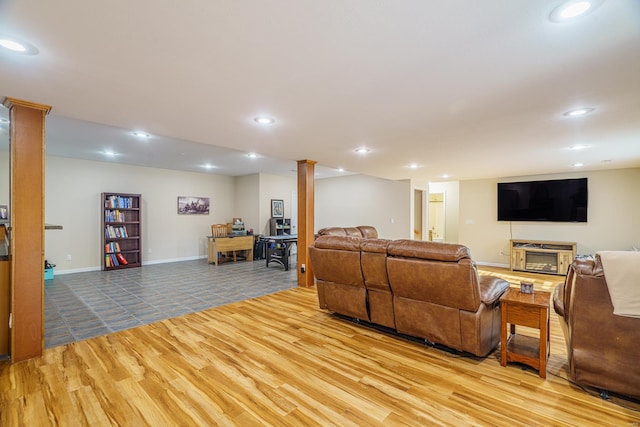 living room featuring light hardwood / wood-style floors and a fireplace