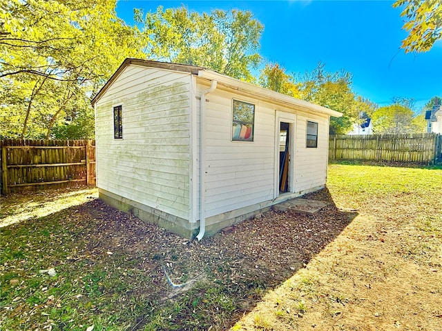 view of outbuilding with a lawn