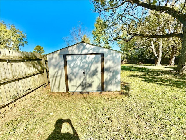 view of outbuilding featuring a lawn