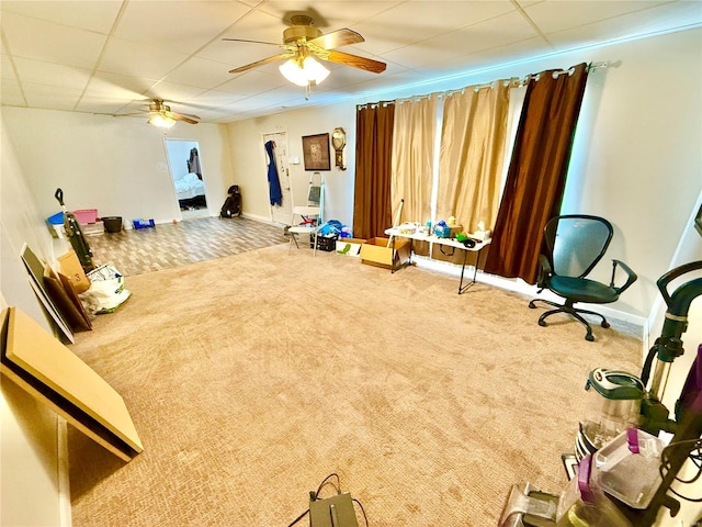 interior space featuring carpet and ceiling fan