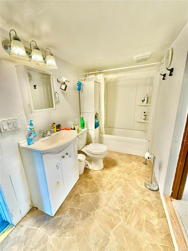 full bathroom featuring vanity, toilet, and shower / bath combo with shower curtain