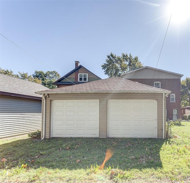 garage with a yard