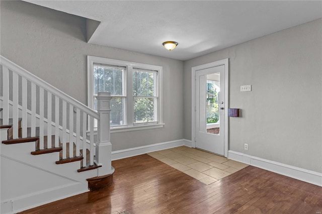 entrance foyer with wood-type flooring and plenty of natural light