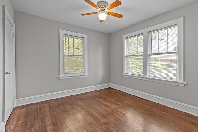 empty room with ceiling fan and wood-type flooring