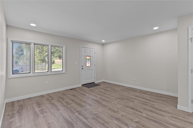 entryway with light hardwood / wood-style flooring