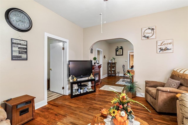 living room with dark hardwood / wood-style floors