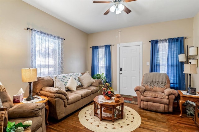 living room with dark hardwood / wood-style floors and ceiling fan