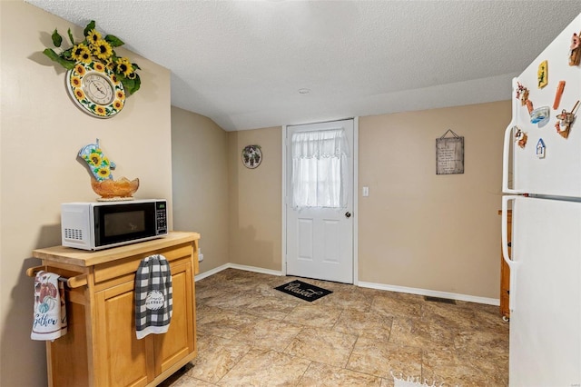 entrance foyer with a textured ceiling