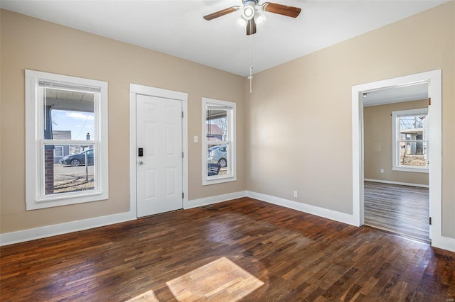 entrance foyer featuring a ceiling fan, baseboards, and wood finished floors