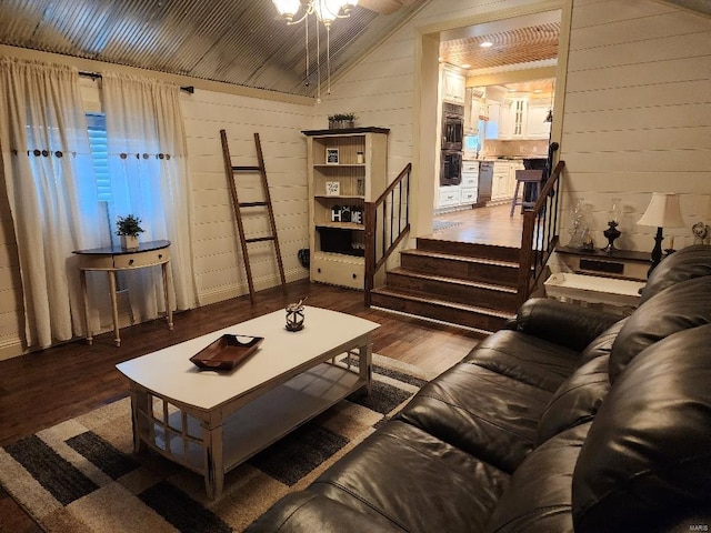 living room featuring lofted ceiling, hardwood / wood-style floors, and wood walls