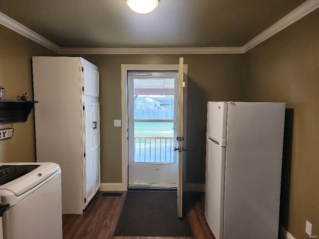 interior space featuring washer / dryer, crown molding, and dark hardwood / wood-style floors