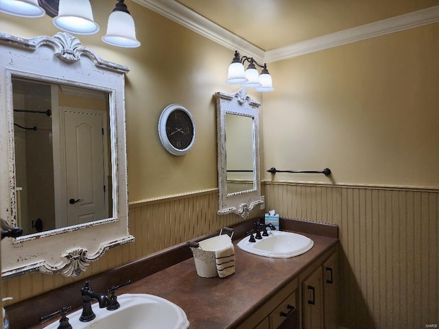 bathroom with vanity, crown molding, and wood walls