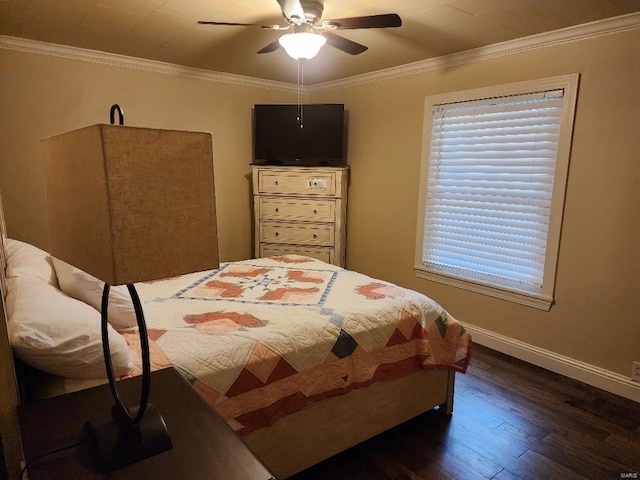 bedroom featuring ornamental molding, dark wood-type flooring, and ceiling fan