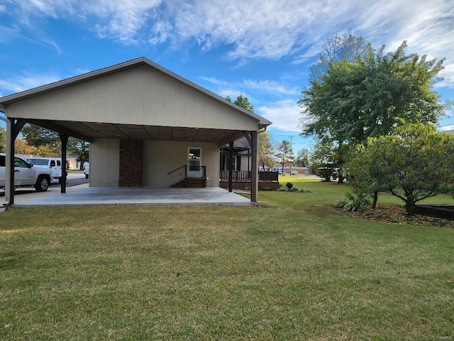 view of property exterior with a yard and a carport