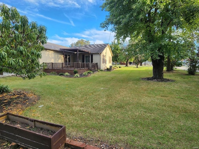 view of yard with a wooden deck