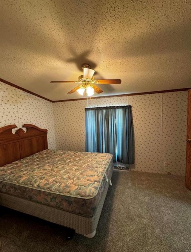 carpeted bedroom with ornamental molding, a textured ceiling, and ceiling fan